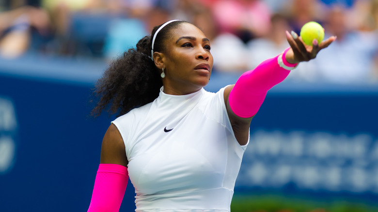 serena williams holding a tennis ball