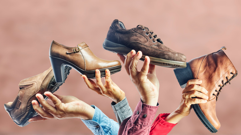 people holding shoes