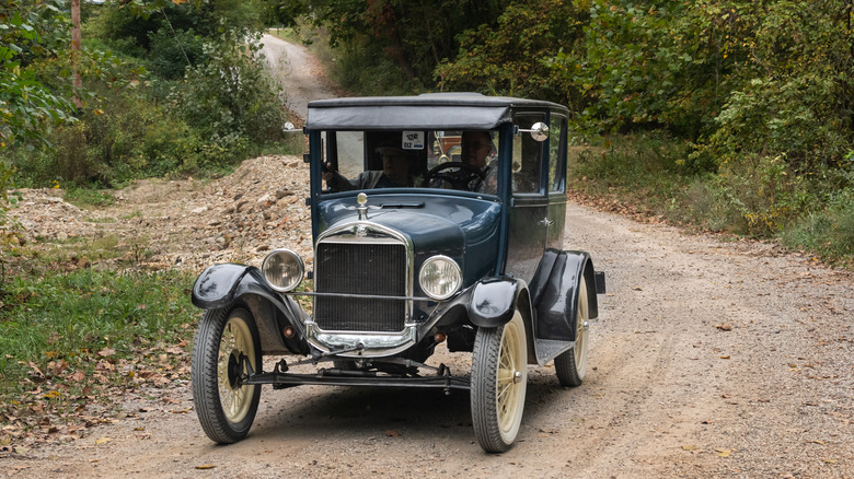 model t ford on dirt road