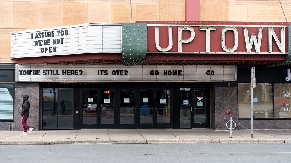 "I assure you we're not open," a reference to the movie Clerks and "You're Still here? Its over. Go home. Go" from Ferris Bueller's Day Off on the Uptown Theatre marquee in Minneapolis, Minnesota, March 28, 2020
