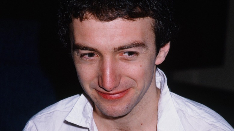 John Deacon smiling
