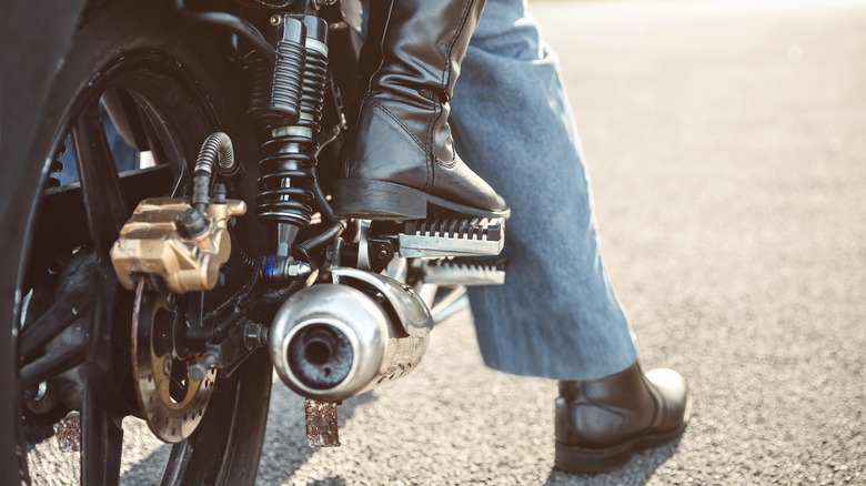 man and woman on motorcycle