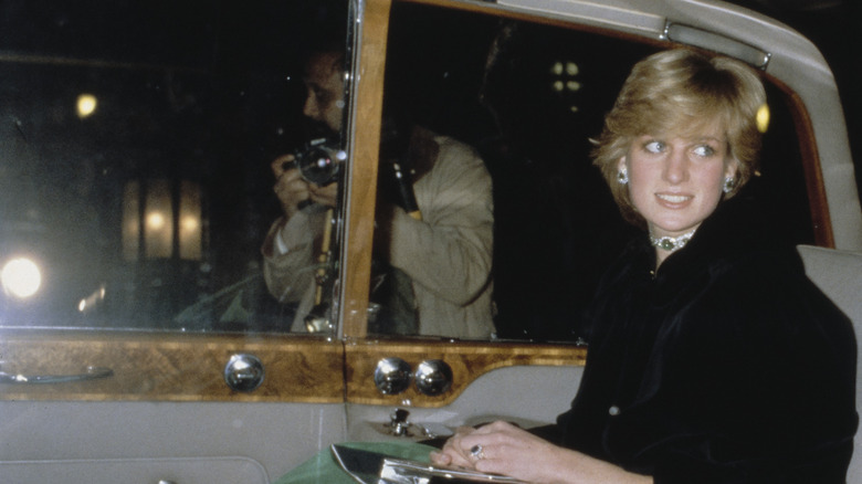 Princess Diana in car photographer outside
