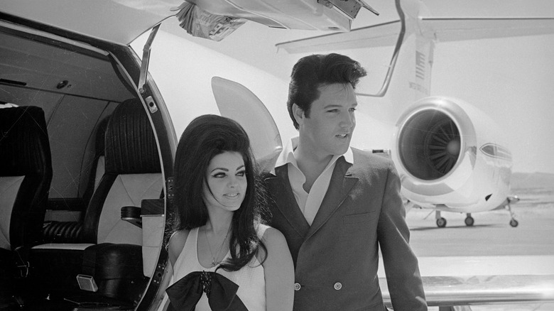 Priscilla Presley and Elvis outside their plane