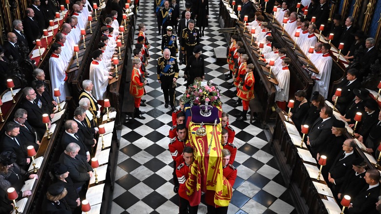 The queen's coffin carried through Westminster Abbey