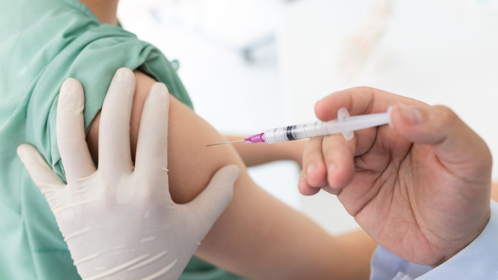 doctor administering vaccine