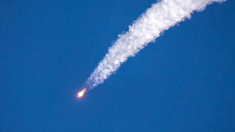 Rocket with a vapor trail.