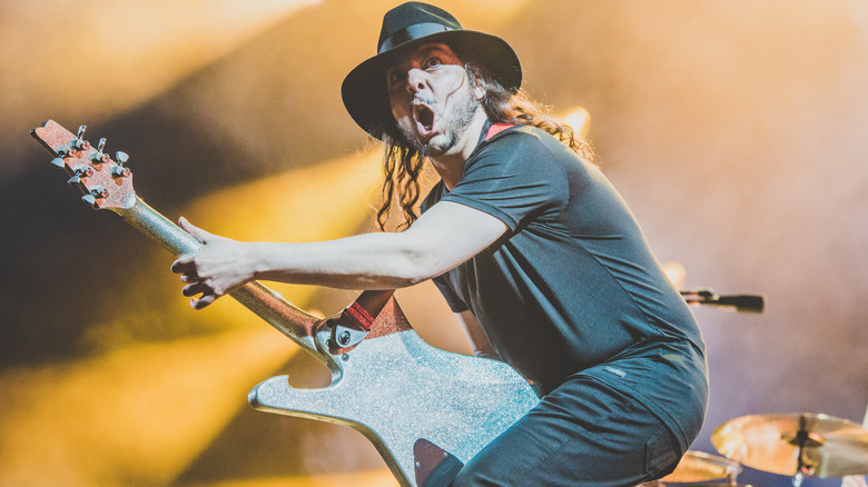 Daron Malakian playing guitar