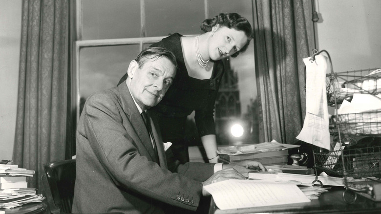 T S Eliot at desk with wife