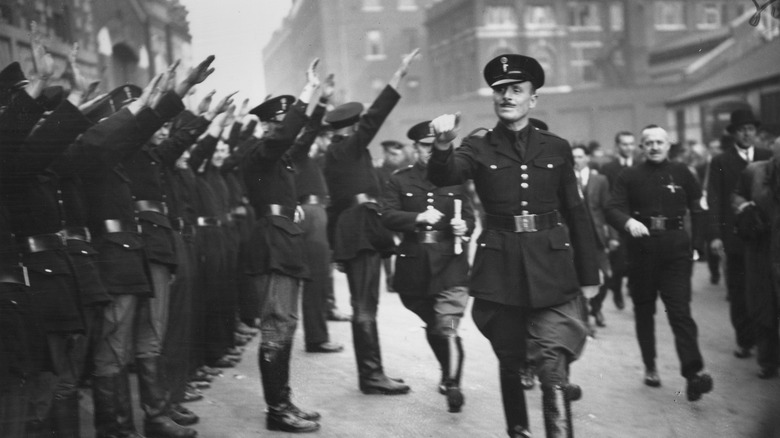 Mosley walks passed a crowd of Blackshirts