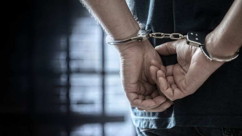 Photo of a prisoner in handcuffs