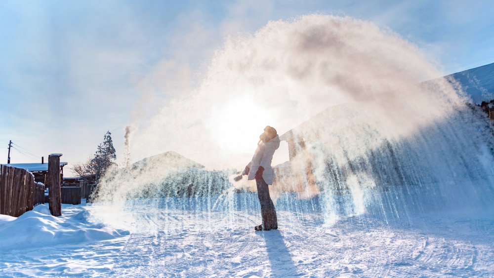 Woman throws hot water and it freezes instantly