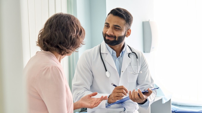 Doctor consulting with patient