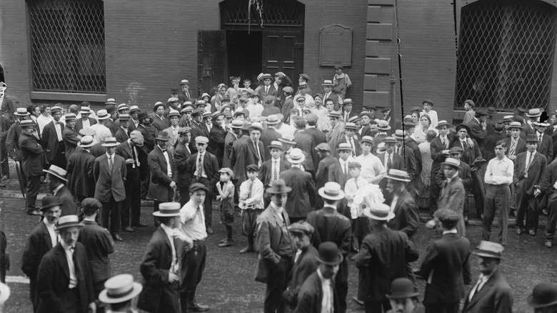 A crowd of people outside of courtoom