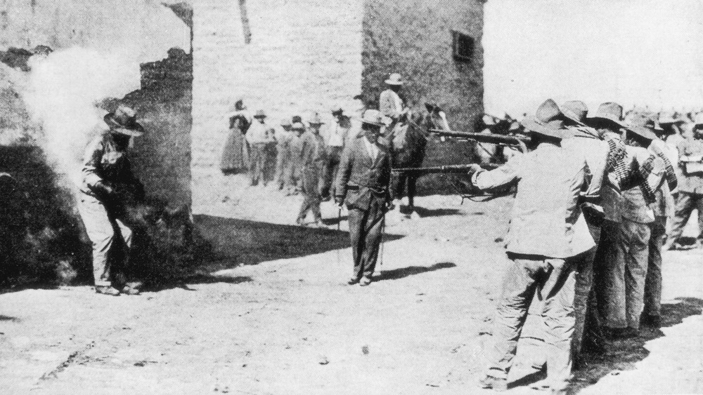 A street execution carried out by followers of rebel leader Venustiano Carranza, in Mexico, circa 1915.