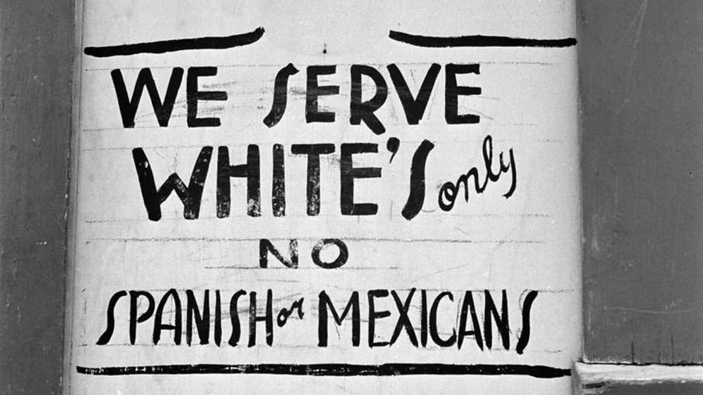 We Serve White's Only No Spanish or Mexicans sign outside a Texas Restaurant, from 1949.