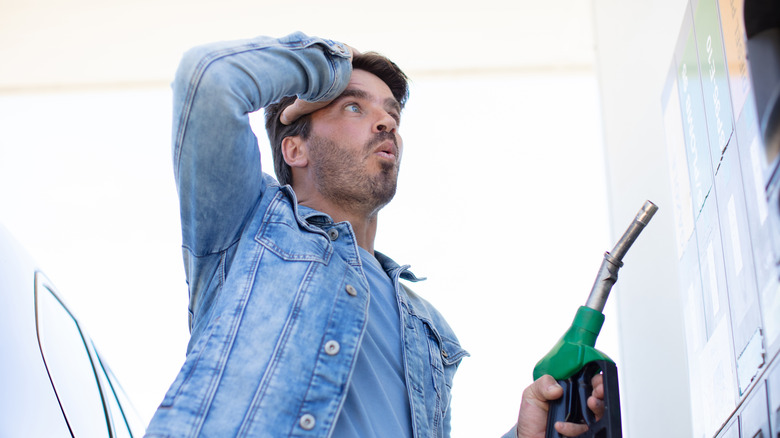 man reacting to gas prices