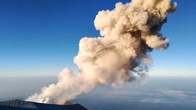 ash cloud coming out of a volcano