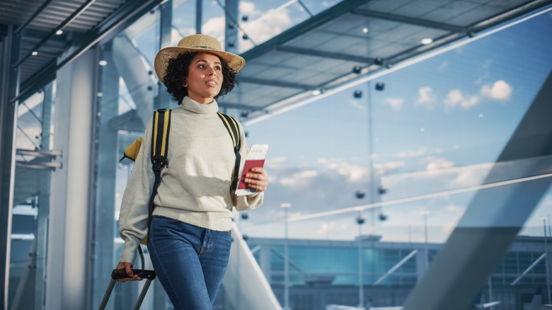 woman walking through airport