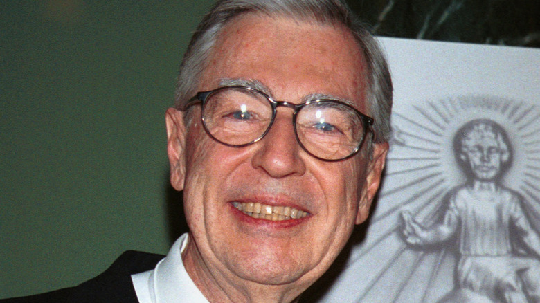 Mr. Rogers smiling wearing glasses