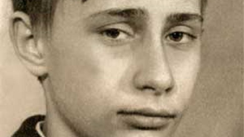 Young Vladimir Putin looking at camera