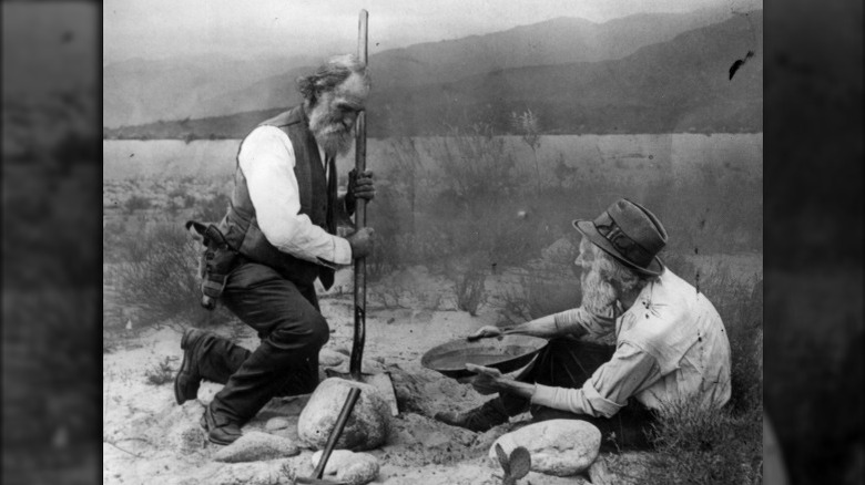 men panning for gold