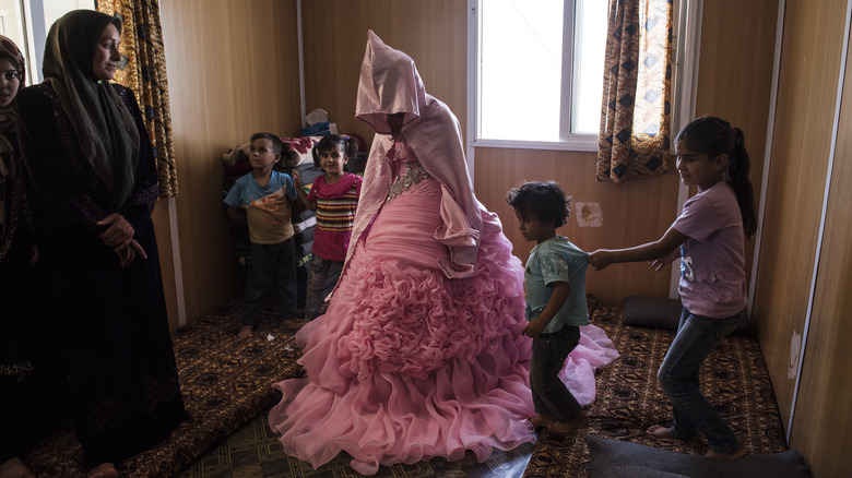 child bride during preparations pink dress