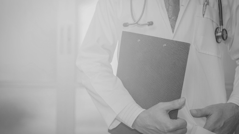 doctor holding records