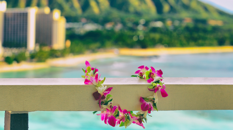 Hawaiian lei, in front of the former capital of the Kingdom of Hawaii.