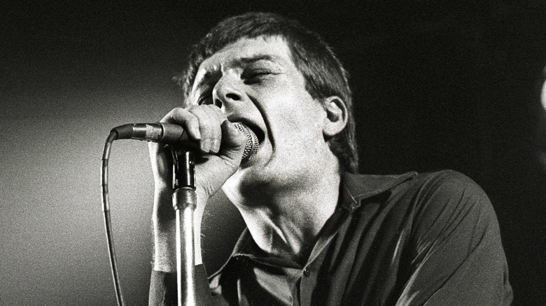 ian curtis singing with joy division in the late 1970s