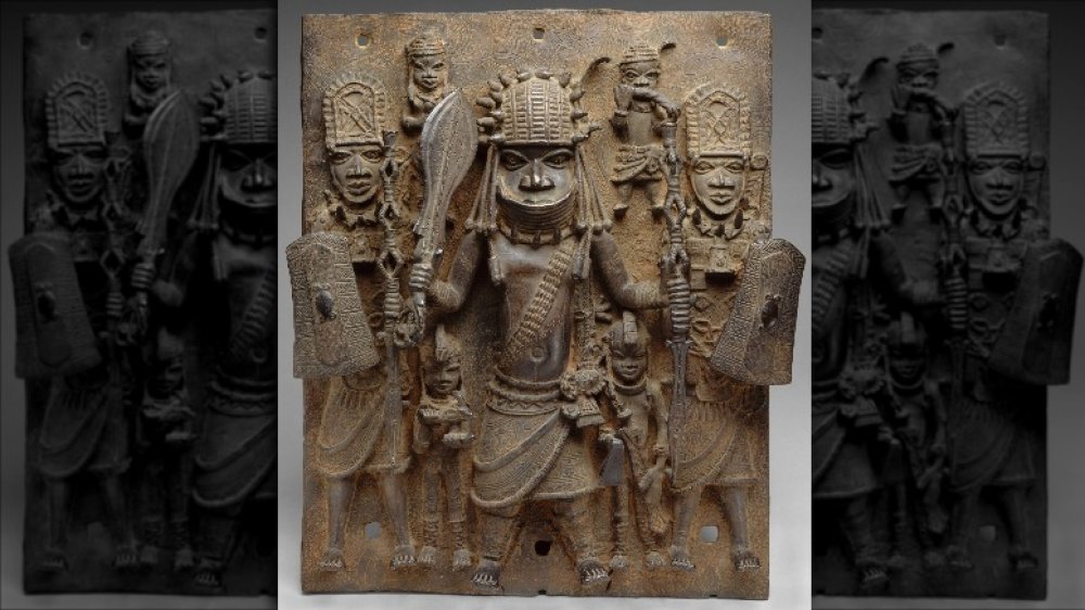 PLAQUE WARRIOR AND ATTENDANTS, 16th-17th c., Nigeria, Africa, Court of Benin, sculpture, cast brass. This work hung on the exterior of the royal palace in Benin City.