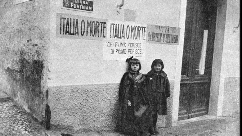 Pro-Italian graffiti on building two girls 