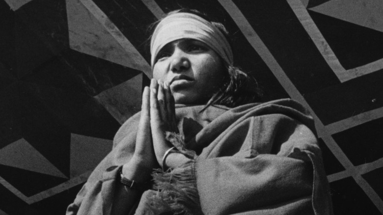 Phoolan Devi, hands pressed together