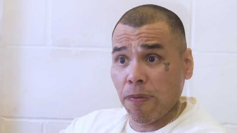 Ramiro Gonzales white shirt necklace tattoo prison