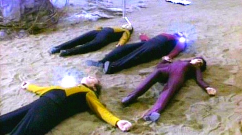 Screenshot of Star Trek TNG cast on the ground in "Power Play"