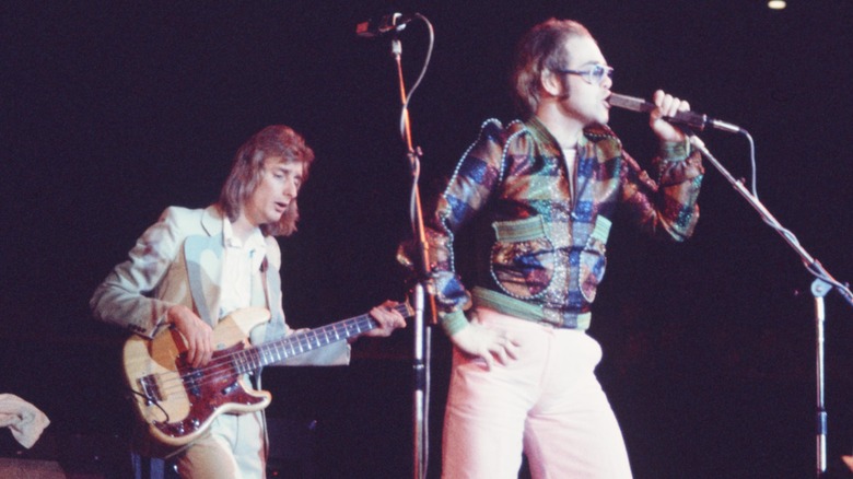 lton john and dee murray performing on stage 1970s