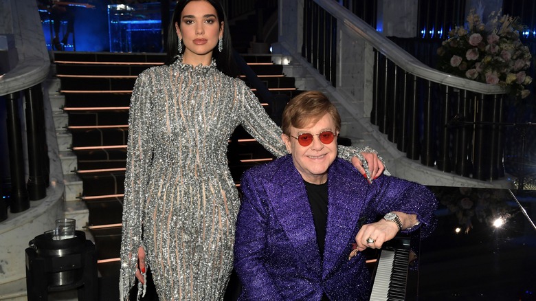 dua lipa and elton john appearing at an event together