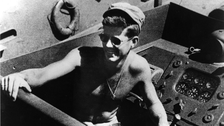 Shirtless JFK on navy boat