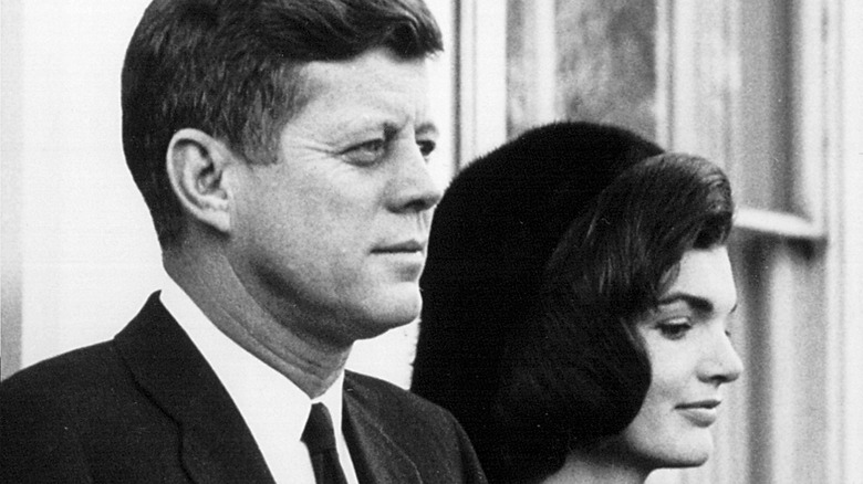 John and Jackie Kennedy look downcast