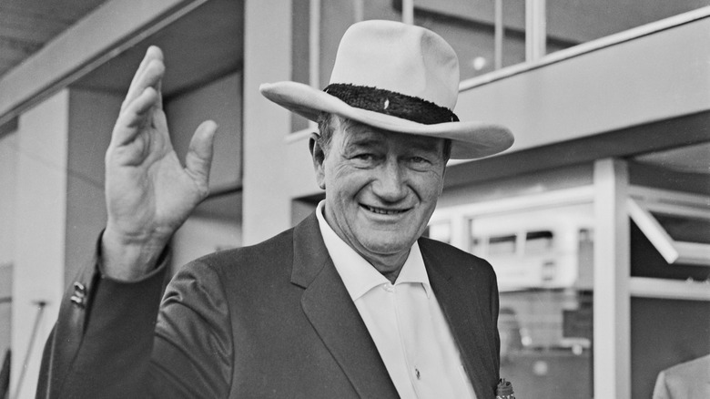 John Wayne waving