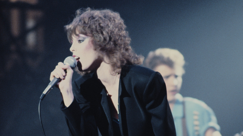 Pat Benatar and Neil Giraldo performing in 1982