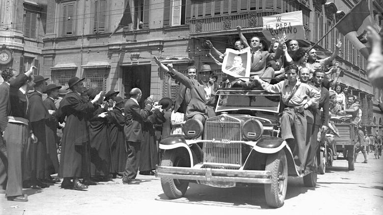 Italian protestors pass the Vatican