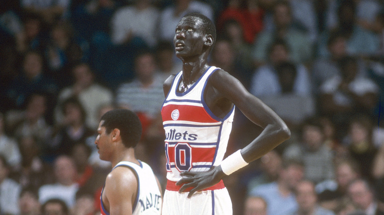 Manute Bol looking upward