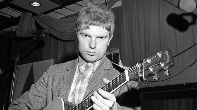 Van Morrison holding a guitar