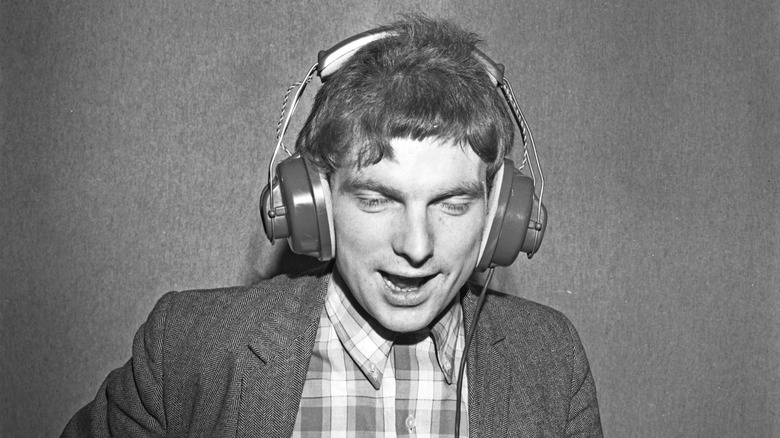 Van Morrison wearing headphones