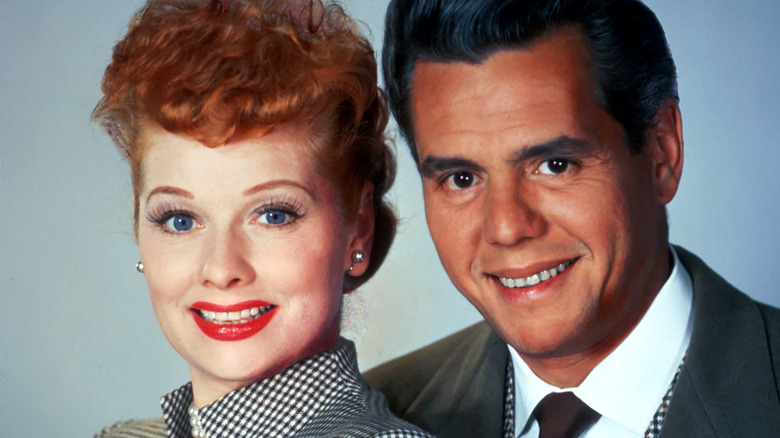 Lucille Ball and Desi Arnaz smiling 