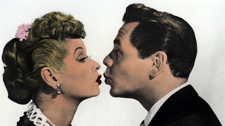 Lucille Ball and Desi Arnaz almost kissing