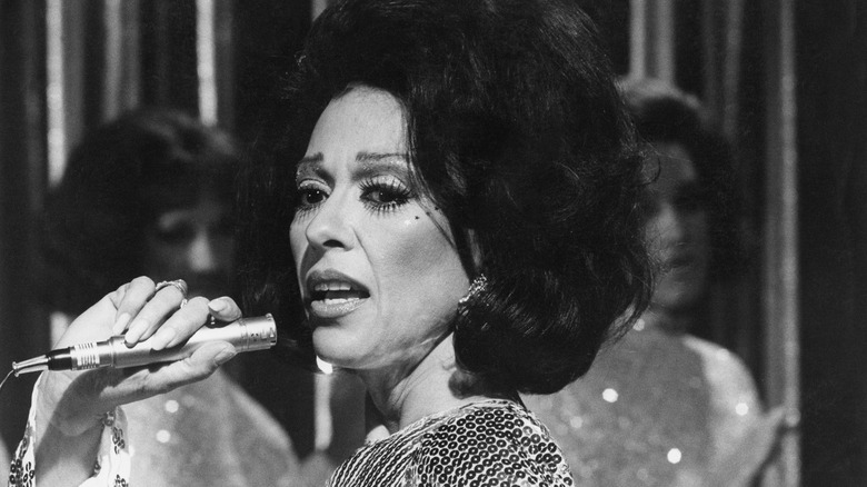 Rita Moreno with microphone in 1975