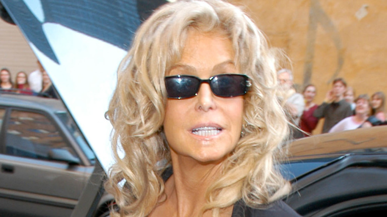 Farrah Fawcett smiling outside sunglasses