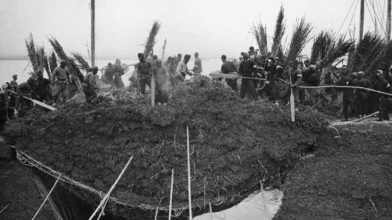 Chinese workers building dam